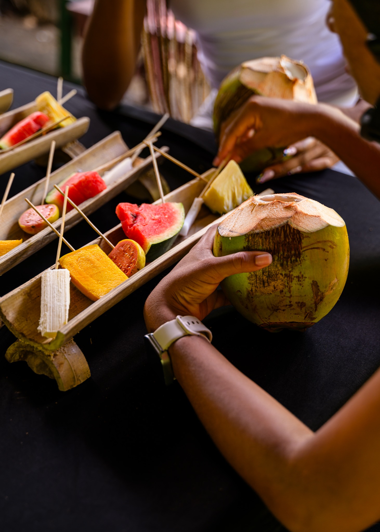 Guests enjoying prepared tropical fruit and fresh coconut in Canaries